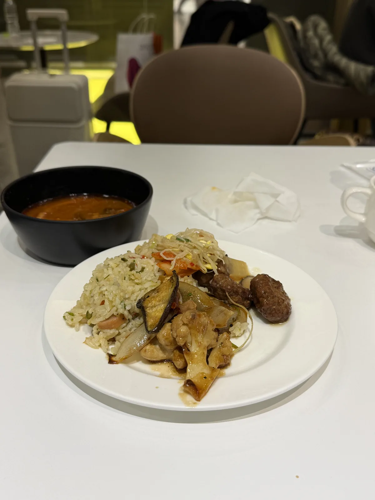 SkyHub Lounge Korean hot food selection including yukgaejang spicy beef soup