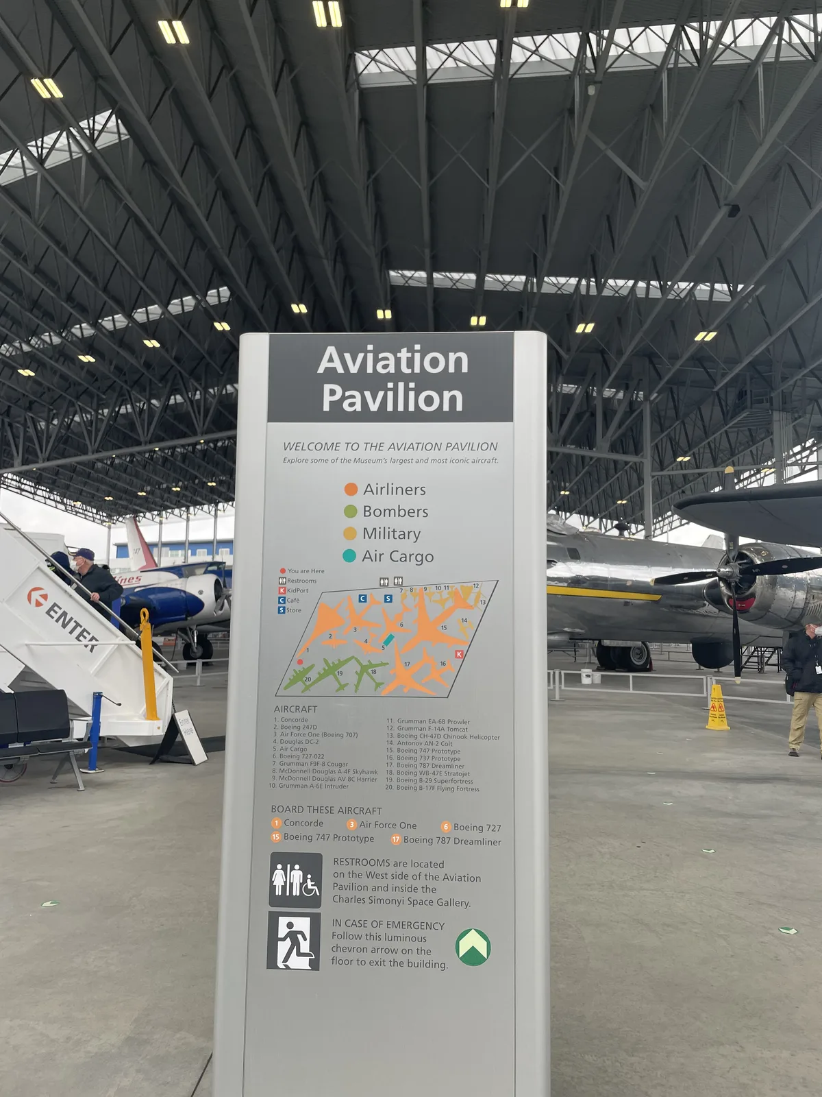 Aviation Pavilion entrance with large historic aircraft on outdoor display
