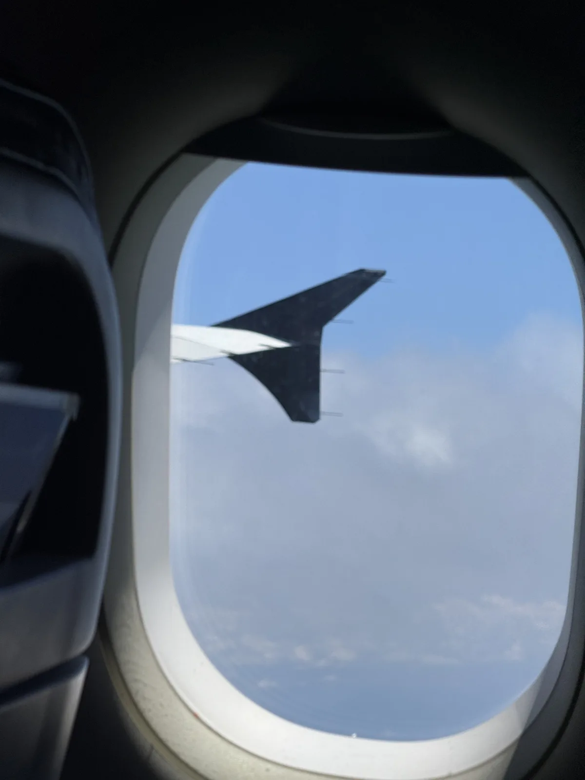 Air New Zealand in-cabin trivia quiz screen displayed on overhead monitors