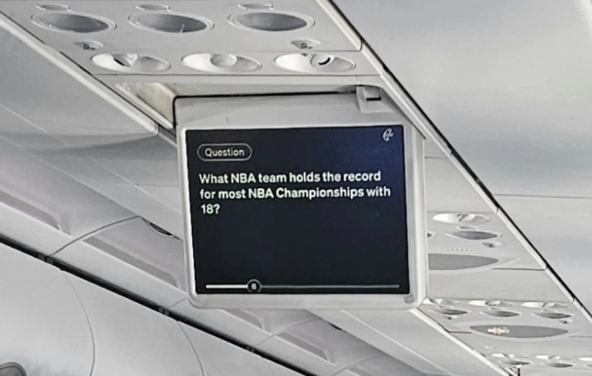 Air New Zealand trivia quiz entertainment on overhead screen during flight