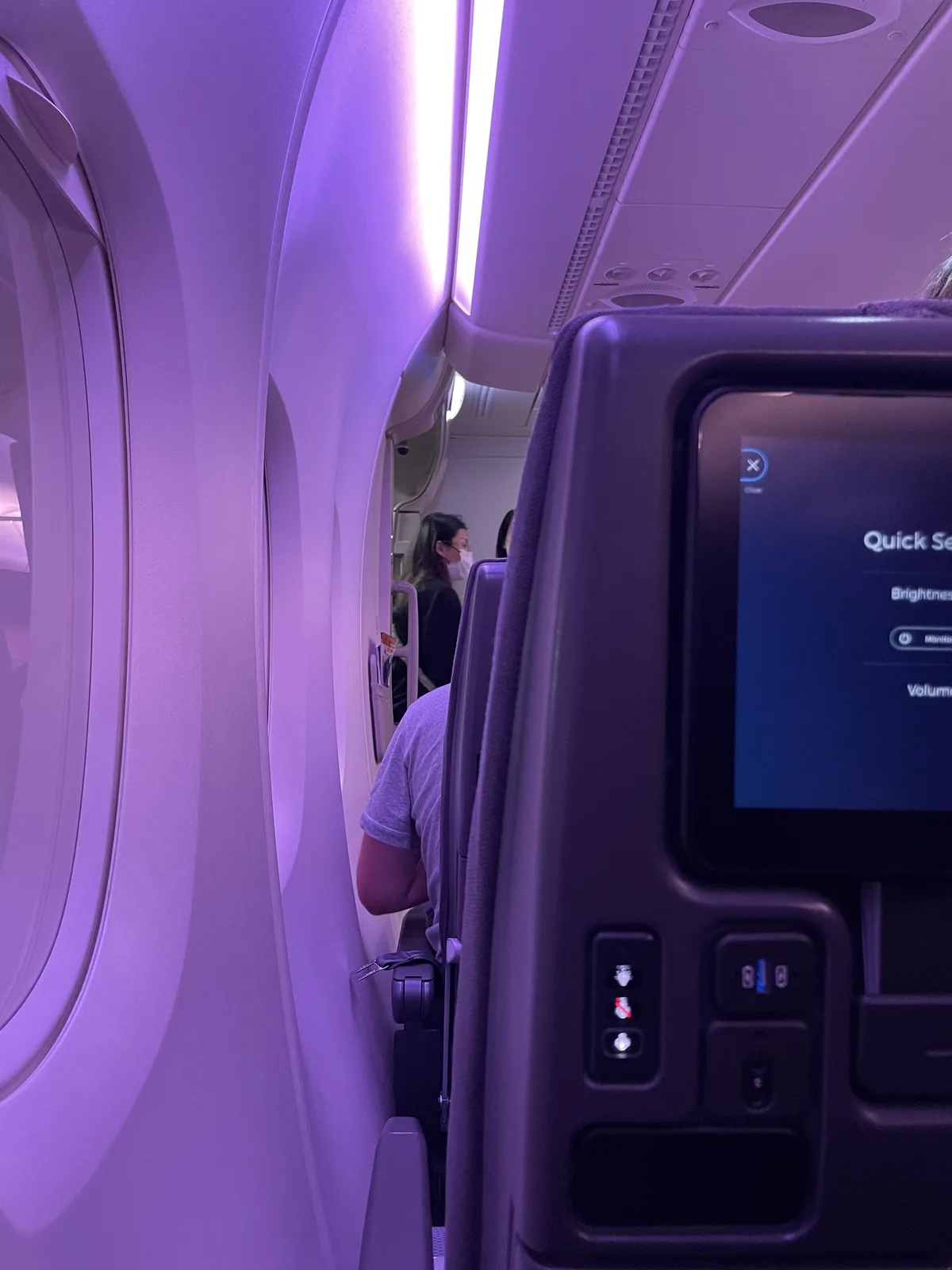 Singapore Airlines A380 economy seat 44K with pillow, blanket, and amenity pouch