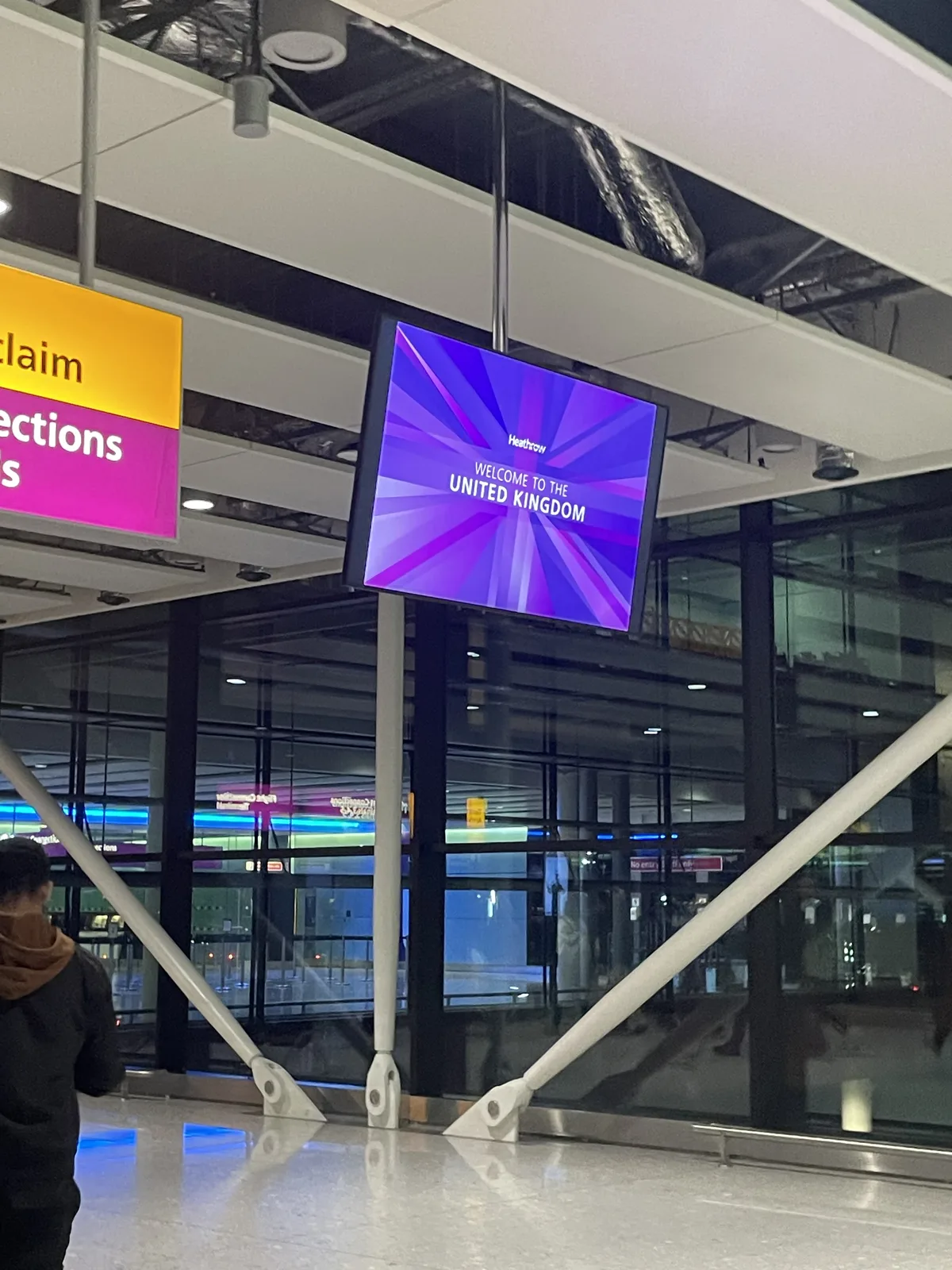 "Welcome to the UK" sign at London Heathrow Airport immigration hall