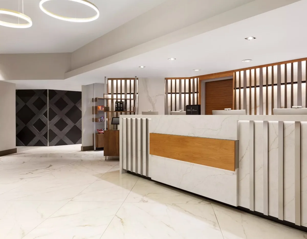 Crowne Plaza Seattle front desk with marble finish and IHG Rewards sign