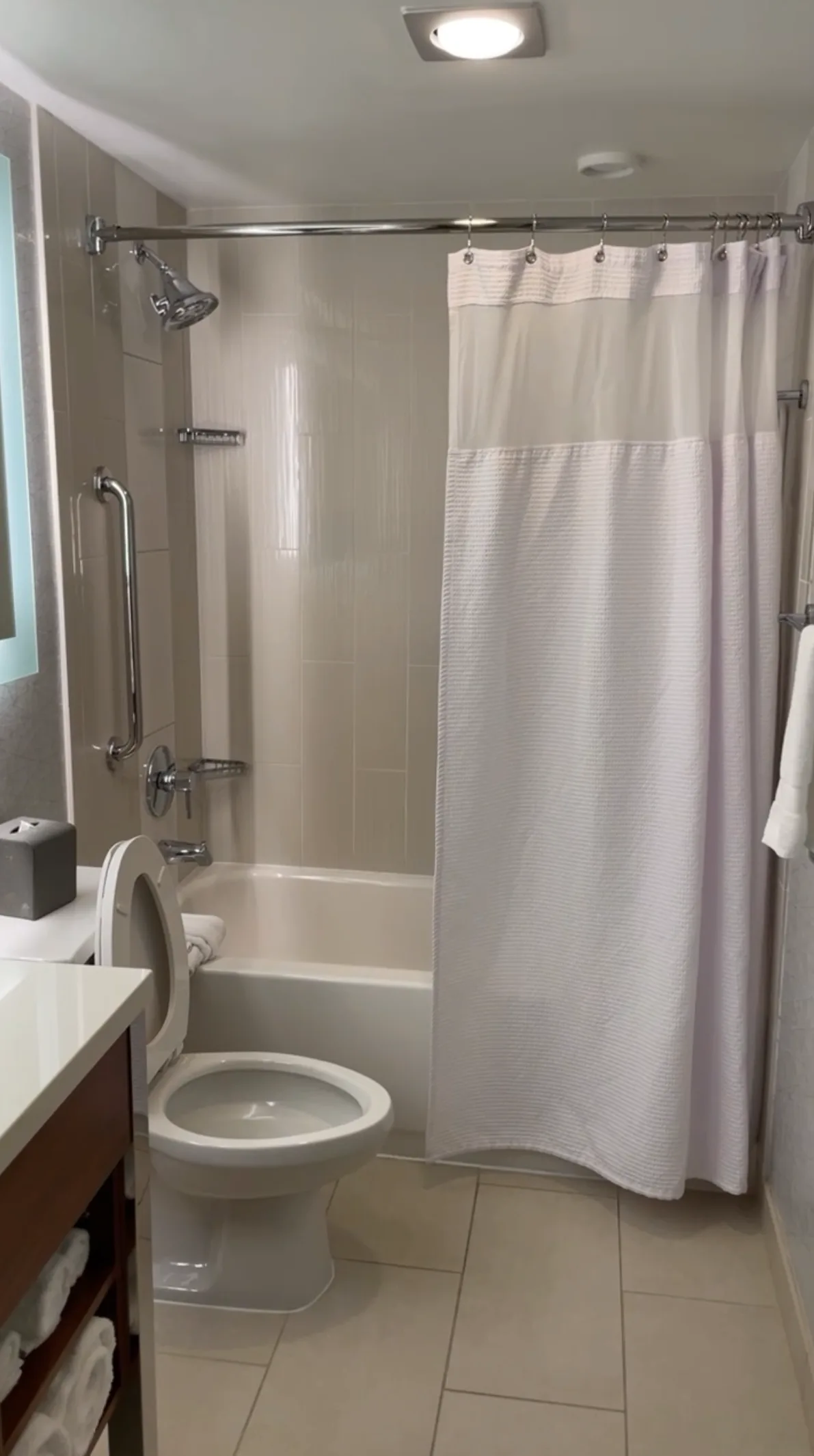 Crowne Plaza Seattle bathroom showing combination bathtub and shower with curtain