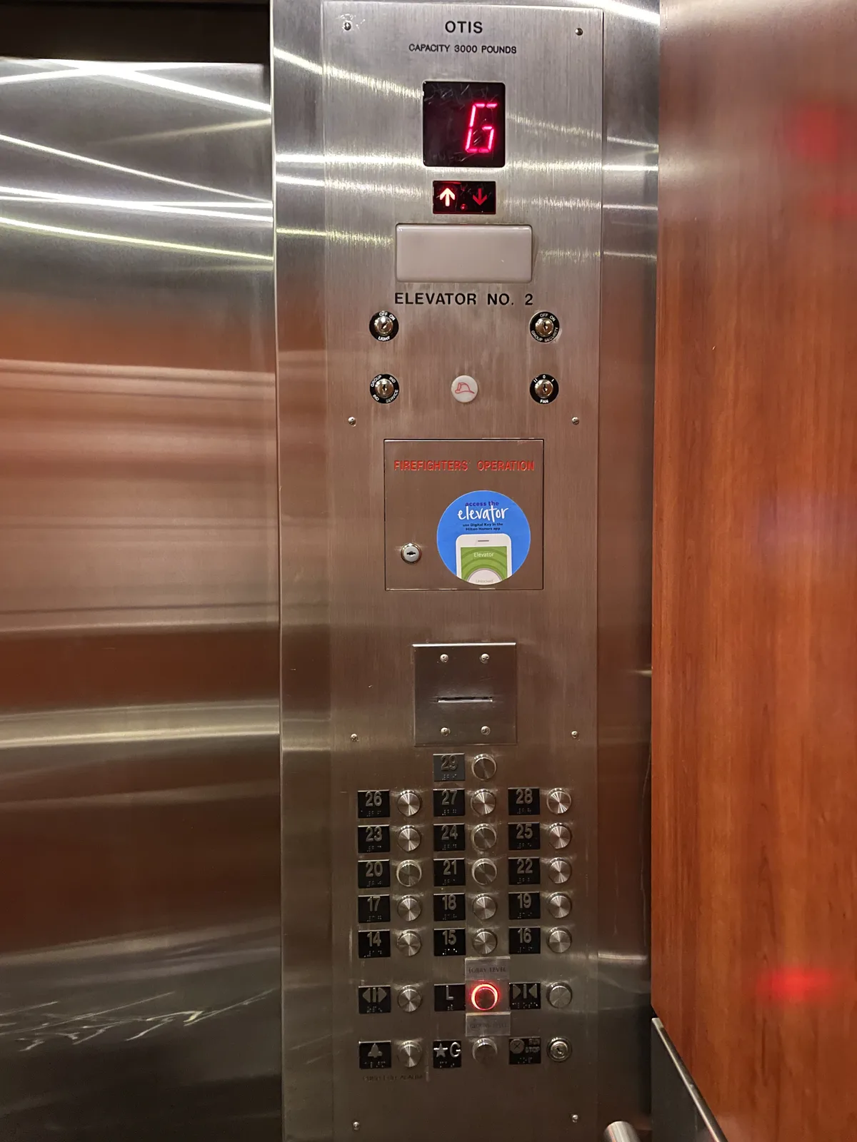 Hilton Seattle elevator interior showing keycard-activated floor button system