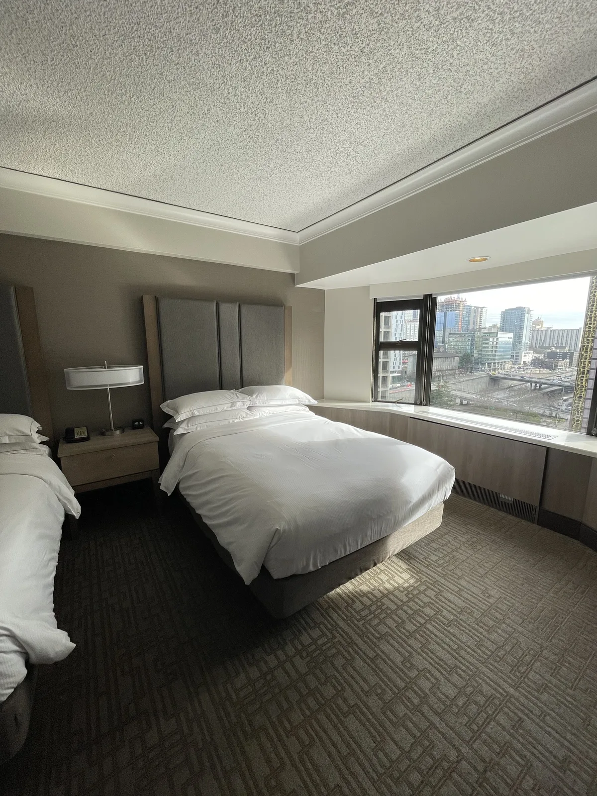Hilton Seattle Double Queen room with two queen beds and city view window