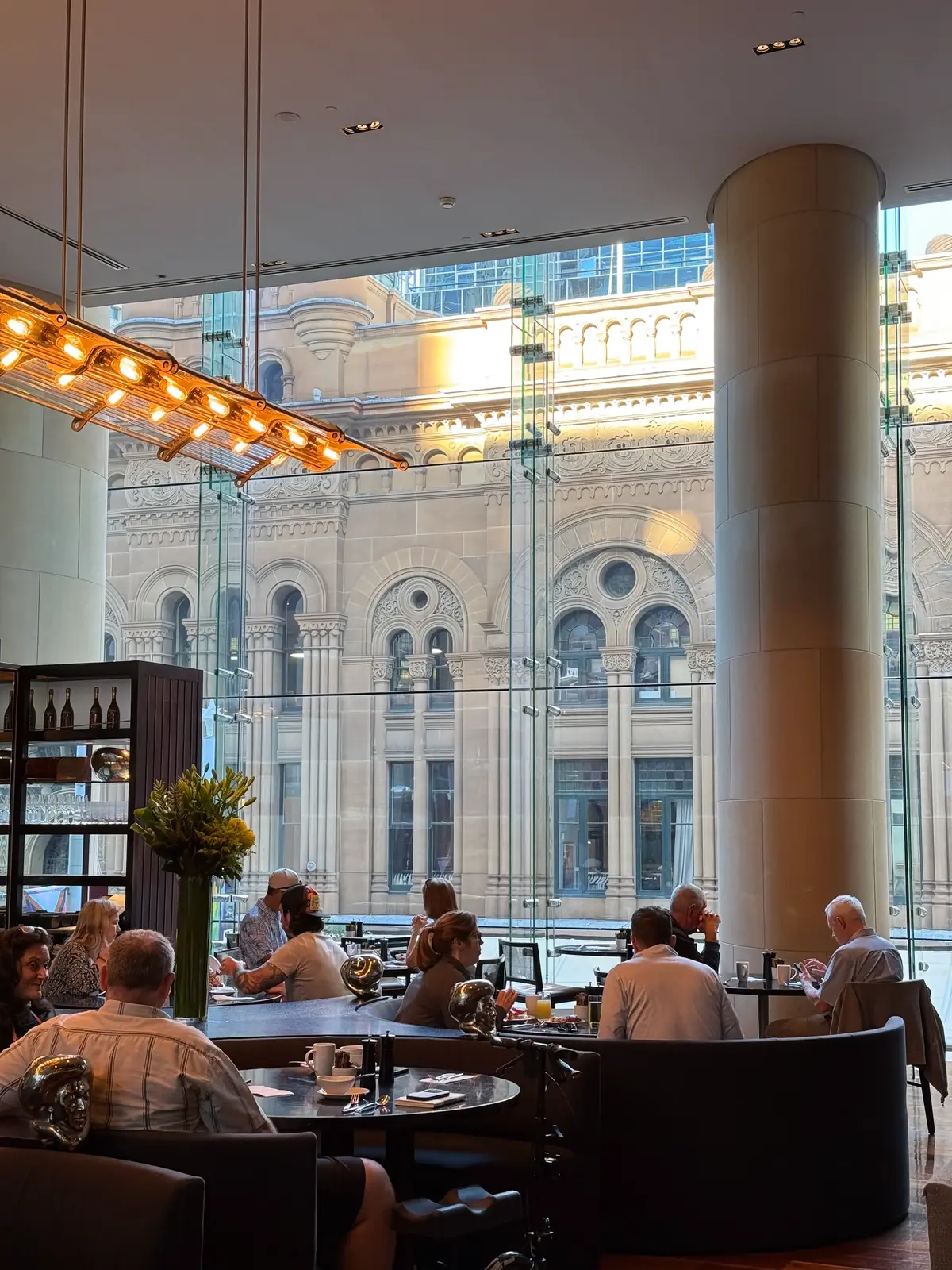 Hilton Sydney breakfast dining room atmosphere with cereal, juice, and coffee machines