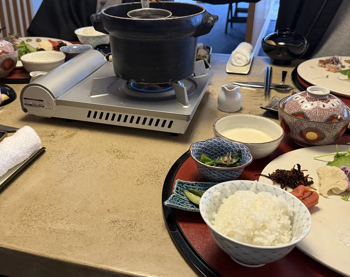 Kuriya Suizan breakfast kaiseki with miso soup iron pot on burner and rice tray