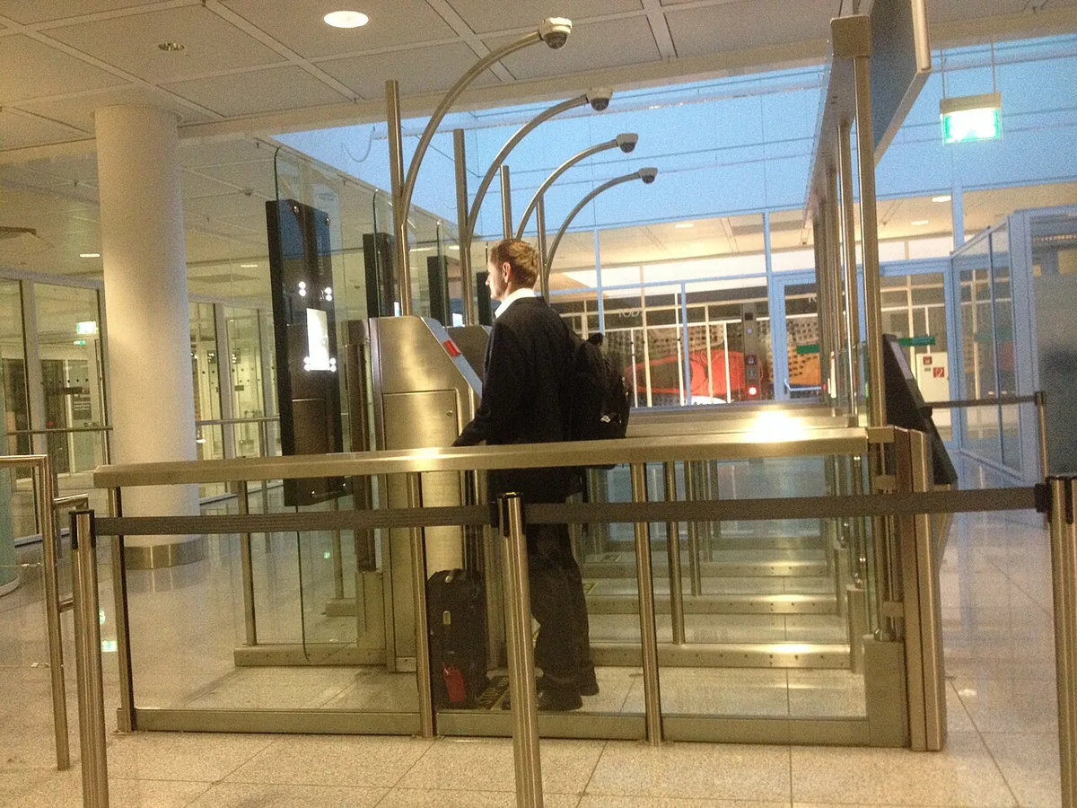 Traveller passing through an automated border gate at Munich Airport