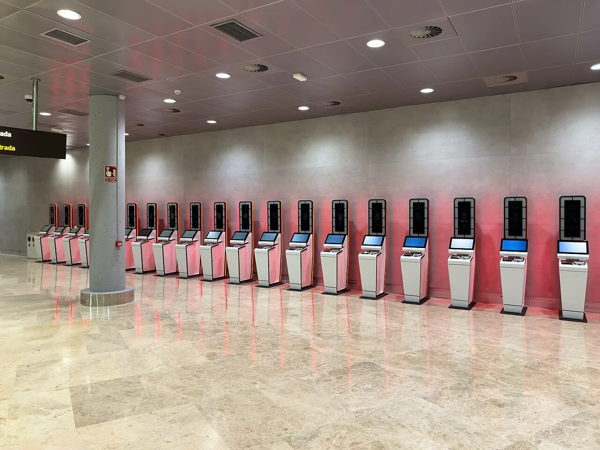 Row of EES registration kiosks in the arrivals area at Valencia Airport, Spain