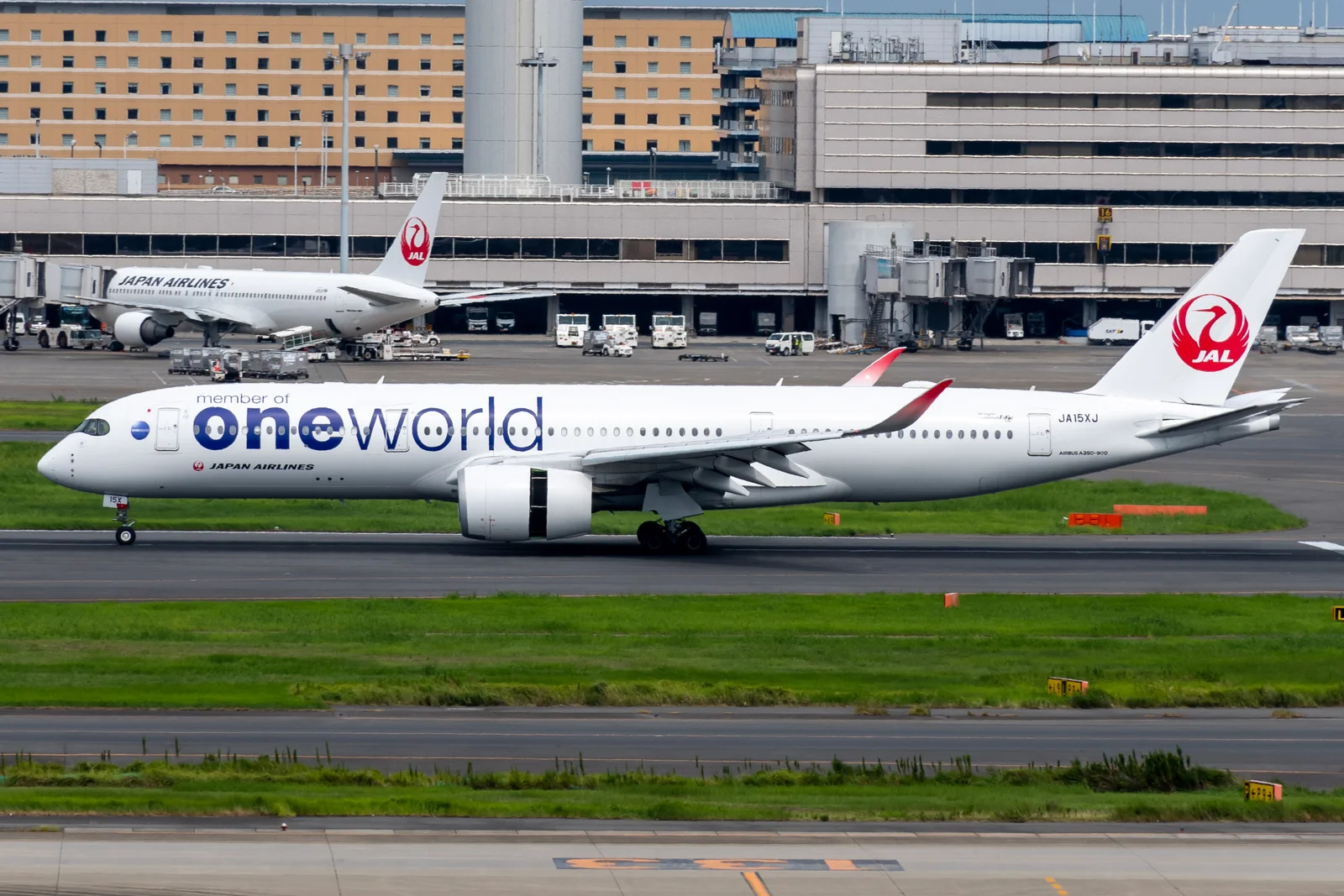 Japan Airlines Airbus A350-900 JA15XJ parked at Tokyo Haneda Airport in special oneworld alliance livery